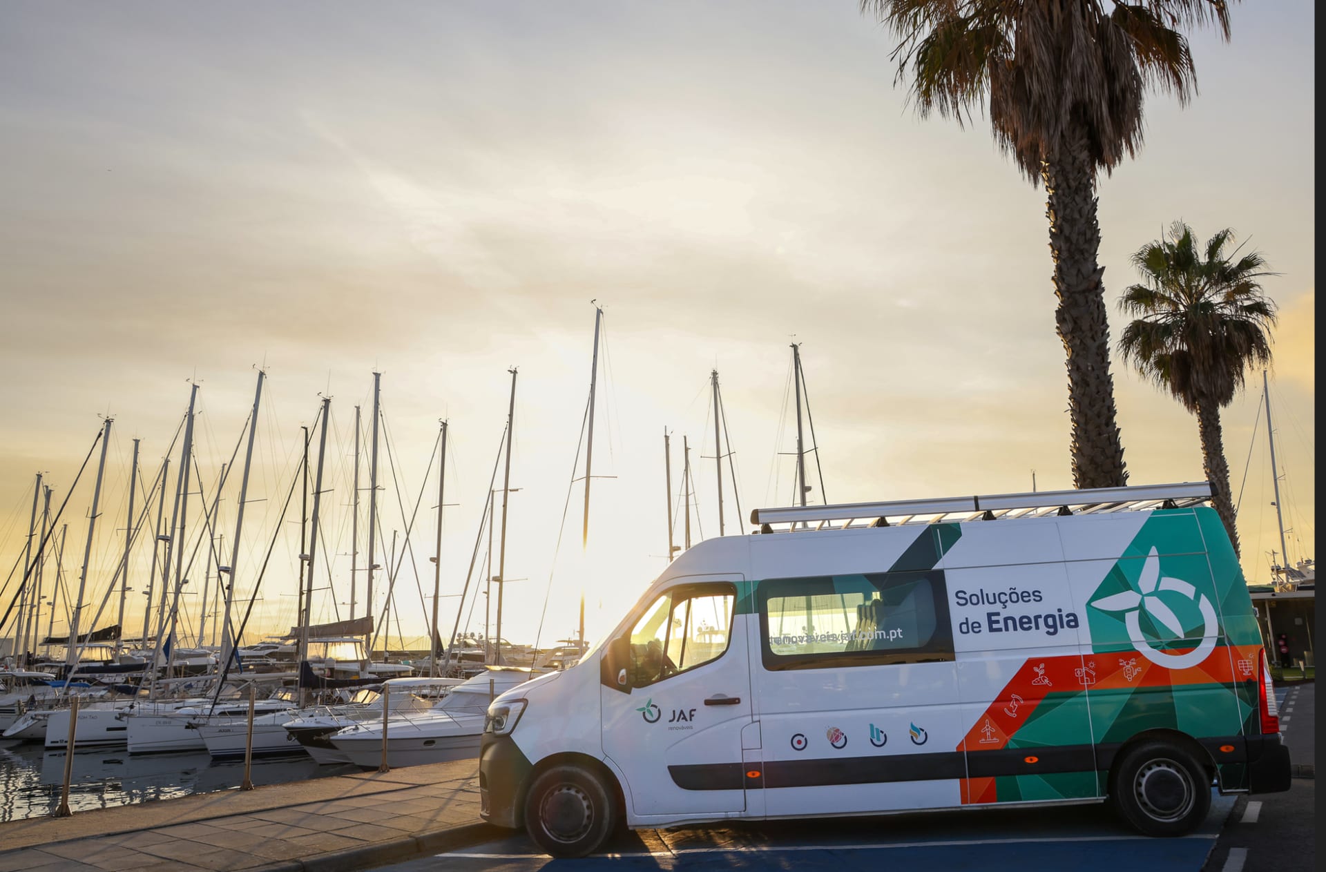 Grupo JAF energy solutions van beside a marina
